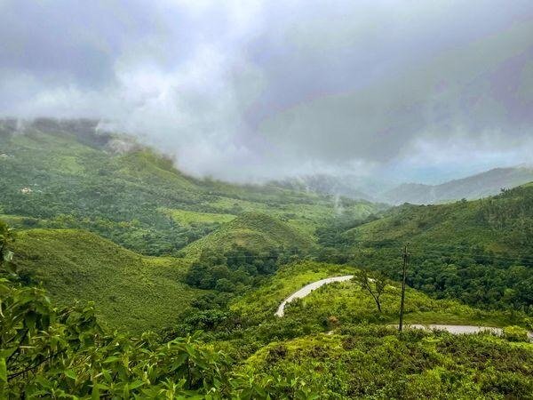 Misty hills and a winding road on a chauffeur trip from Bangalore to Chikmagalur